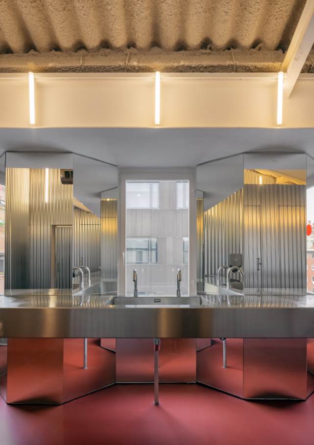 Forkstone’s transformation highlights the careful balance between preserving the building's historic character and meeting the needs of a modern office. The bathroom has been reimagined as a sanctuary for office workers, with undulating steel walls, red flooring and minimalist design elements. Roca’s Loft electronic faucets and Ona wall-hung WCs blend seamlessly into the overall design, adding comfort and practicality to this innovative workspace.6