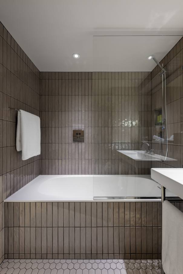 The Ona wall-hung Roca Rimless® toilet and Fineceramic® basin were chosen for their functional design and innovative technology. The toilet enhances hygiene and space efficiency, while the Fineceramic® basin offers durability and sophisticated design. The Pyros Stonex® shower tray with its ultra-thin profile and discreet linear drain contributes to the neat aesthetic. This partnership exemplifies how thoughtful design and cutting-edge technology can enhance historic spaces, creating a timeless synergy between Victorian elegance and contemporary comfort.