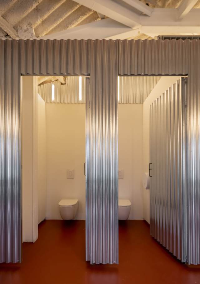 Forkstone’s transformation highlights the careful balance between preserving the building's historic character and meeting the needs of a modern office. The bathroom has been reimagined as a sanctuary for office workers, with undulating steel walls, red flooring and minimalist design elements. Roca’s Loft electronic faucets and Ona wall-hung WCs blend seamlessly into the overall design, adding comfort and practicality to this innovative workspace.5