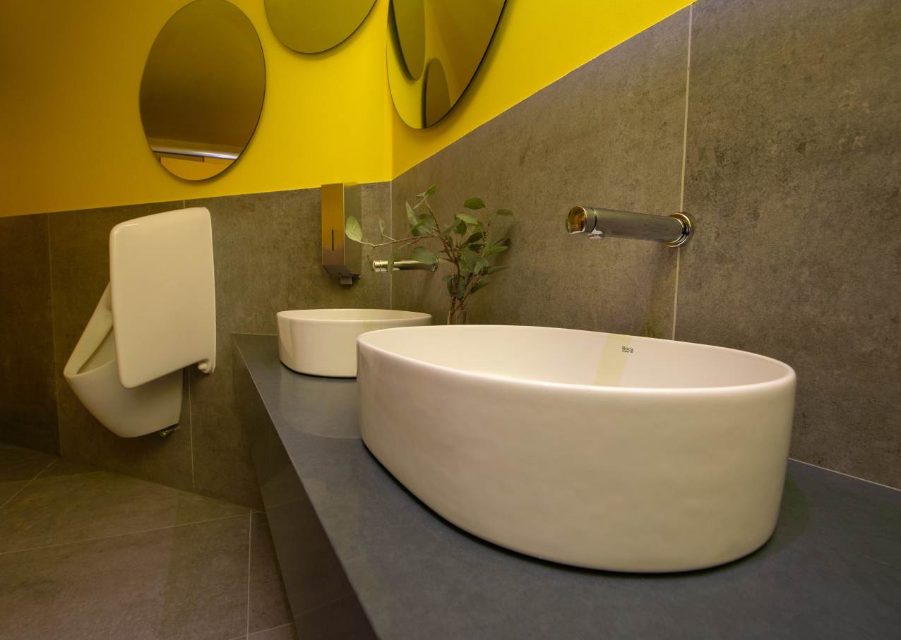 The pavilion at Expo 2020 combined bold, colourful design with innovation and sustainability, showcasing Roca’s advanced bathroom solutions. Vibrant cones provided functional cooling, while Roca’s Inspira and Beyond WCs complemented the pavilion’s flowing forms and sustainability goals with water-saving technology. Inside, Inspira basins, Luna and Iridia mirrors, and Wing urinal partitions echoed the pavilion’s playful yet sophisticated aesthetic. Products like the EP1 electronic dual flush plate and Avant self-closing faucet highlighted Roca’s commitment to water efficiency, blending seamlessly with the pavilion’s circular economy principles and human-centric design philosophy.6