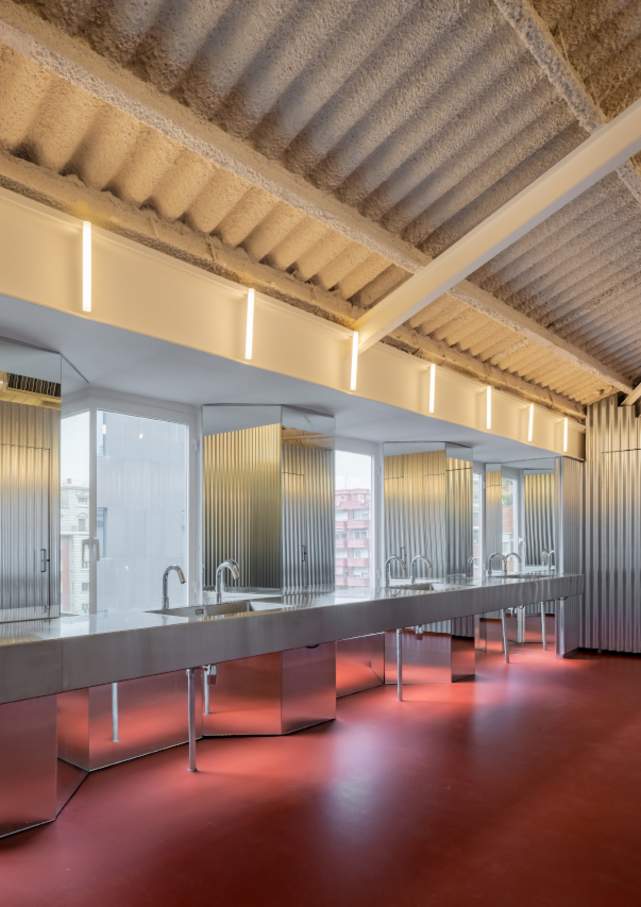 Forkstone’s transformation highlights the careful balance between preserving the building's historic character and meeting the needs of a modern office. The bathroom has been reimagined as a sanctuary for office workers, with undulating steel walls, red flooring and minimalist design elements. Roca’s Loft electronic faucets and Ona wall-hung WCs blend seamlessly into the overall design, adding comfort and practicality to this innovative workspace.8