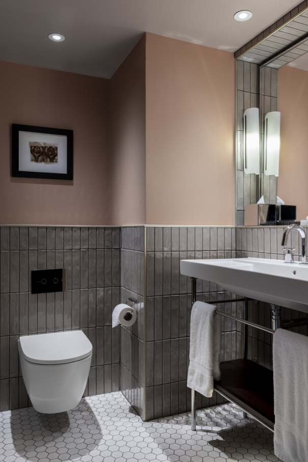 The Ona wall-hung Roca Rimless® toilet and Fineceramic® basin were chosen for their functional design and innovative technology. The toilet enhances hygiene and space efficiency, while the Fineceramic® basin offers durability and sophisticated design. The Pyros Stonex® shower tray with its ultra-thin profile and discreet linear drain contributes to the neat aesthetic. This partnership exemplifies how thoughtful design and cutting-edge technology can enhance historic spaces, creating a timeless synergy between Victorian elegance and contemporary comfort.3